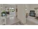 Open foyer with tile flooring, leading to a spacious living area and other rooms at 3624 Belle Rose Dr, Leesburg, FL 34748