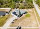 Aerial view of home highlighting the solar panels, shed, and surrounding landscape at 380 Dorset Ave, Deltona, FL 32738