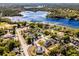 Panoramic aerial view showcasing the home's location near a lake and residential area at 380 Dorset Ave, Deltona, FL 32738