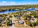 An aerial view showing this home's property lines and its proximity to a scenic lake at 380 Dorset Ave, Deltona, FL 32738