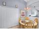 This home offers a charming dining area with an ornate chandelier at 380 Dorset Ave, Deltona, FL 32738