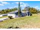 Lovely single-story home featuring a two-car garage and lush green lawn at 380 Dorset Ave, Deltona, FL 32738