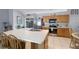Spacious kitchen with a large island that offers bar seating, stainless steel appliances, and ample counter space at 380 Dorset Ave, Deltona, FL 32738
