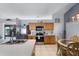 Open kitchen featuring stainless steel appliances, a breakfast nook and tile backsplash at 380 Dorset Ave, Deltona, FL 32738