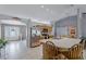 Bright kitchen featuring an island with bar stool seating and stainless steel appliances at 380 Dorset Ave, Deltona, FL 32738