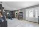 Large open-concept living room with neutral color palette and abundant light at 380 Dorset Ave, Deltona, FL 32738