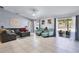 Inviting living room with lots of seating and sliding glass doors to the backyard at 380 Dorset Ave, Deltona, FL 32738
