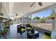 Screened patio with comfortable seating and views of the backyard at 380 Dorset Ave, Deltona, FL 32738