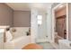 Bathroom featuring tiled tub, glass-enclosed shower, and decorative vanity space to prep for your day at 452 Opal Ct, Altamonte Springs, FL 32714