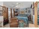 Blue bedroom showcases eclectic decor, a ceiling fan, and a comfortable chair perfect for unwinding after a long day at 452 Opal Ct, Altamonte Springs, FL 32714