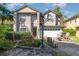 Charming two-story home with landscaped front yard and a driveway with basketball hoop at 452 Opal Ct, Altamonte Springs, FL 32714