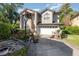 Charming two-story home with landscaped front yard and a driveway with basketball hoop at 452 Opal Ct, Altamonte Springs, FL 32714
