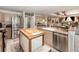 Charming kitchen boasts stainless steel appliances, an island with butcher block top, and a double basin sink at 452 Opal Ct, Altamonte Springs, FL 32714