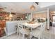 Open kitchen and dining area with warm lighting, light cabinets and stainless appliances at 452 Opal Ct, Altamonte Springs, FL 32714