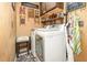 Cozy laundry room with stacked washer and dryer, rustic decor, and 'laundry' drop your pants here sign at 452 Opal Ct, Altamonte Springs, FL 32714