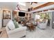 Bright, open living room with comfortable seating, a view of the entryway, and decor on the walls at 452 Opal Ct, Altamonte Springs, FL 32714
