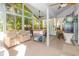 Enclosed sunroom flooded with natural light, perfect for relaxation and entertaining at 452 Opal Ct, Altamonte Springs, FL 32714
