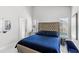 Bright bedroom showcases a luxurious bed, side tables, backyard views, and access to a pool at 459 Tivoli Cir, Davenport, FL 33837