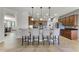 Spacious kitchen with bar seating, stainless steel appliances, and tiled backsplash at 4631 Cypress Forest Ln, St Cloud, FL 34772