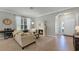 Bright and cozy living area with a fireplace and comfortable seating, perfect for relaxation at 4631 Cypress Forest Ln, St Cloud, FL 34772