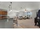 Expansive living room with a comfortable sectional and views of the backyard at 4631 Cypress Forest Ln, St Cloud, FL 34772