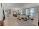 Open-concept living room with a comfortable seating area and dining space with lots of natural light at 4631 Cypress Forest Ln, St Cloud, FL 34772