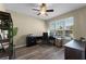 Bright home office space with modern wood floors and a large window, great for working from home at 4631 Cypress Forest Ln, St Cloud, FL 34772