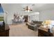 Open-concept living area seamlessly connecting the kitchen with a large seating area, ideal for gatherings at 4631 Cypress Forest Ln, St Cloud, FL 34772