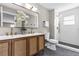 Bathroom with double vanity, modern fixtures, and a glass-enclosed shower at 5307 Sandy Hill Dr, Orlando, FL 32821