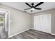 This bedroom features wood-look flooring and a closet at 5307 Sandy Hill Dr, Orlando, FL 32821