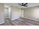 This is a cozy bedroom with gray plank flooring and a ceiling fan at 5307 Sandy Hill Dr, Orlando, FL 32821