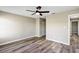 This bedroom features wood-look flooring and a ceiling fan at 5307 Sandy Hill Dr, Orlando, FL 32821