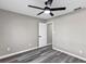 This bedroom features wood-look flooring and a ceiling fan at 5307 Sandy Hill Dr, Orlando, FL 32821