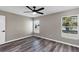 This bedroom features wood-look flooring and two windows at 5307 Sandy Hill Dr, Orlando, FL 32821
