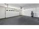 This garage has a white door and concrete flooring at 5307 Sandy Hill Dr, Orlando, FL 32821