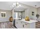 Open-concept kitchen featuring a quartz island with stainless steel dishwasher at 5307 Sandy Hill Dr, Orlando, FL 32821