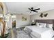 Stylish main bedroom with ceiling fan, neutral paint, closet, and an ensuite bathroom at 5307 Sandy Hill Dr, Orlando, FL 32821
