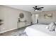 Cozy main bedroom with a ceiling fan, neutral paint, and access to the ensuite bathroom at 5307 Sandy Hill Dr, Orlando, FL 32821