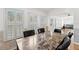 Sunlit dining area with plantation shutters and a view to the outdoors at 5414 Zinnia St, Leesburg, FL 34748