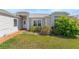 Charming home featuring an inviting entrance with well-maintained landscaping and curb appeal at 5414 Zinnia St, Leesburg, FL 34748