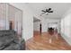 Open living space with wood-look floors and vaulted ceilings at 5414 Zinnia St, Leesburg, FL 34748