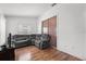 Cozy living room featuring a comfortable gray sectional and laminate wood flooring at 5414 Zinnia St, Leesburg, FL 34748