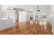 Bright, open-concept living space with hardwood floors, high ceilings, and lots of natural light at 5414 Zinnia St, Leesburg, FL 34748