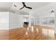 Bright, open-plan living and dining area with wood-look floors at 5414 Zinnia St, Leesburg, FL 34748