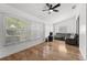 Comfortable living room with large windows and wood-look flooring at 5414 Zinnia St, Leesburg, FL 34748