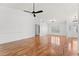 Bright, open-plan living area with wood-look floors at 5414 Zinnia St, Leesburg, FL 34748