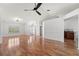 Bright, open-plan living area with wood-look floors at 5414 Zinnia St, Leesburg, FL 34748