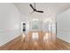 Bright, open-plan living area with wood-look floors at 5414 Zinnia St, Leesburg, FL 34748