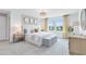 Serene bedroom featuring a large window, soft carpeting, and elegant furnishings creating a relaxing retreat at 6033 Tree Crossing Ln, St Cloud, FL 34771