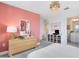 Stylish bedroom showcasing modern decor, including a chic dresser and unique wall art at 6033 Tree Crossing Ln, St Cloud, FL 34771